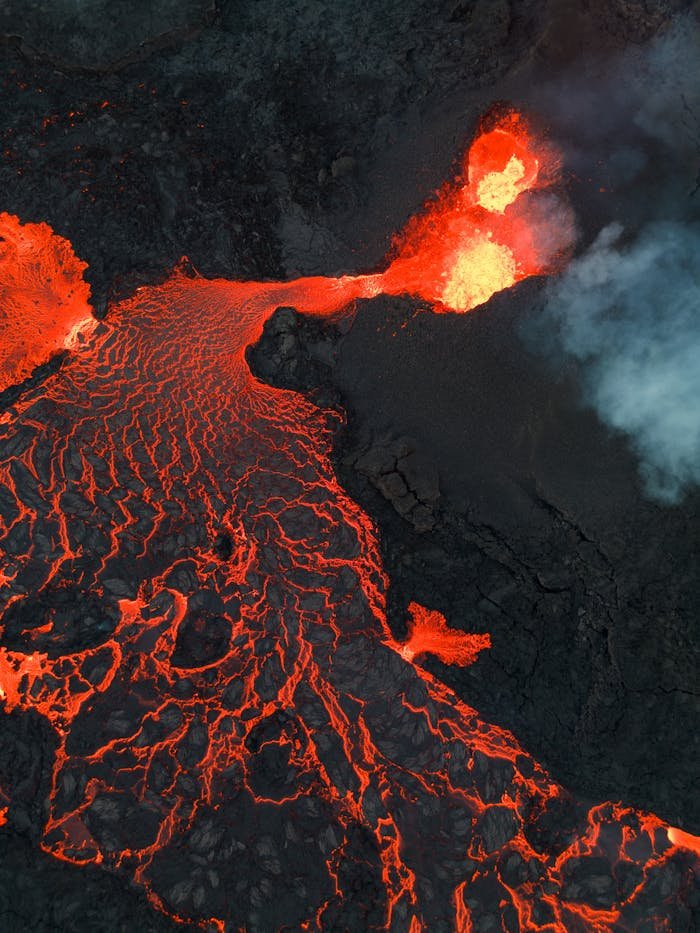 A stunning aerial view capturing the vibrant, molten lava flow from Fagradalsfjall Volcano in Iceland.